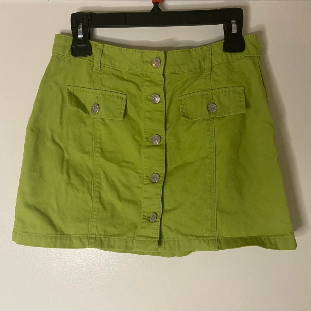 Green button up mini skirt. Size large but can fit a size medium as well.